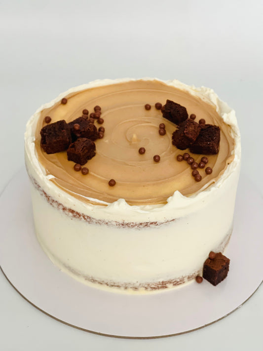 Rich chocolate birthday cake with hazelnut Bueno filling, crisp pearls and fudge brownies