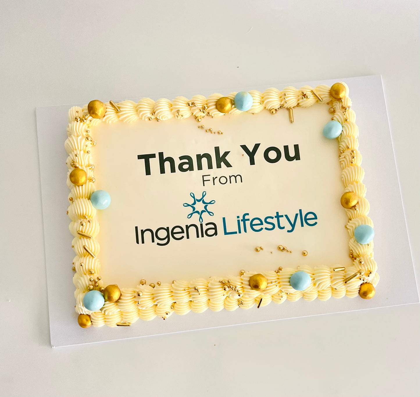 rectangle cake with corporate logo and designed to match the colour scheme