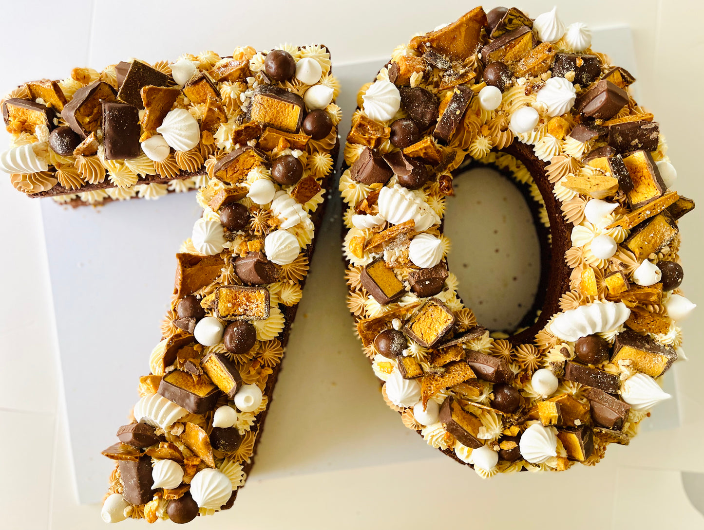 70th birthday cake with honey comb and violet crumble