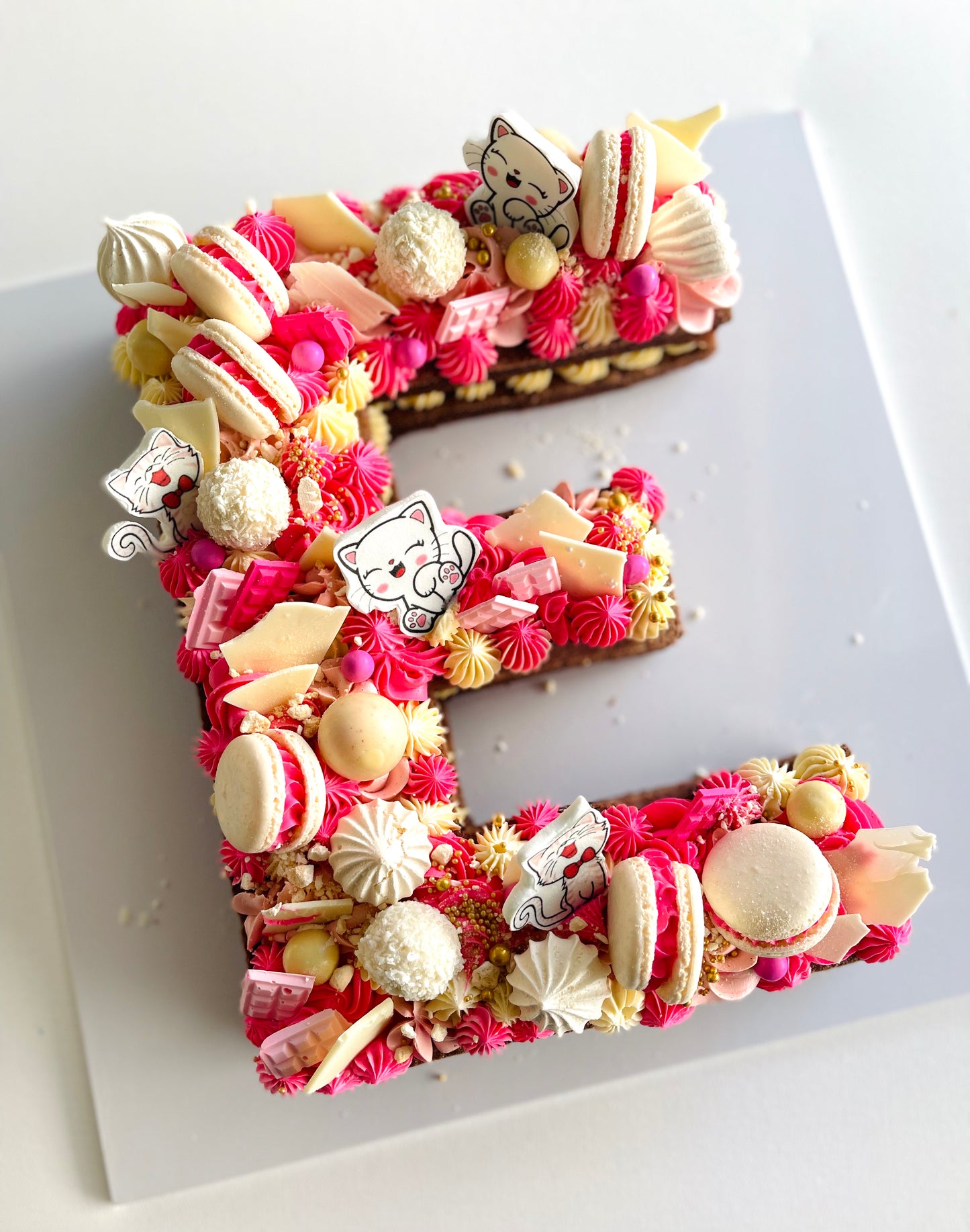 pink cat theme alphabet cake