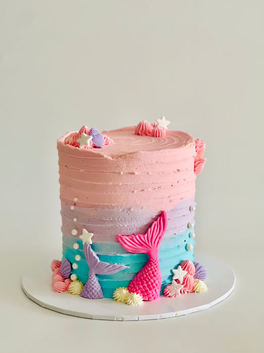 pastel mermaid cake with fins, shells & star fishes