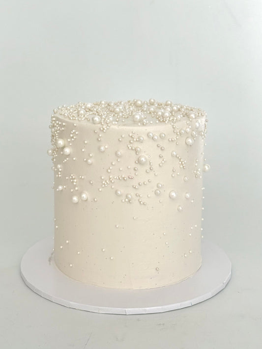 white cake with pearls