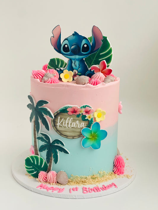 Stitch theme cake with characters, sand and shells