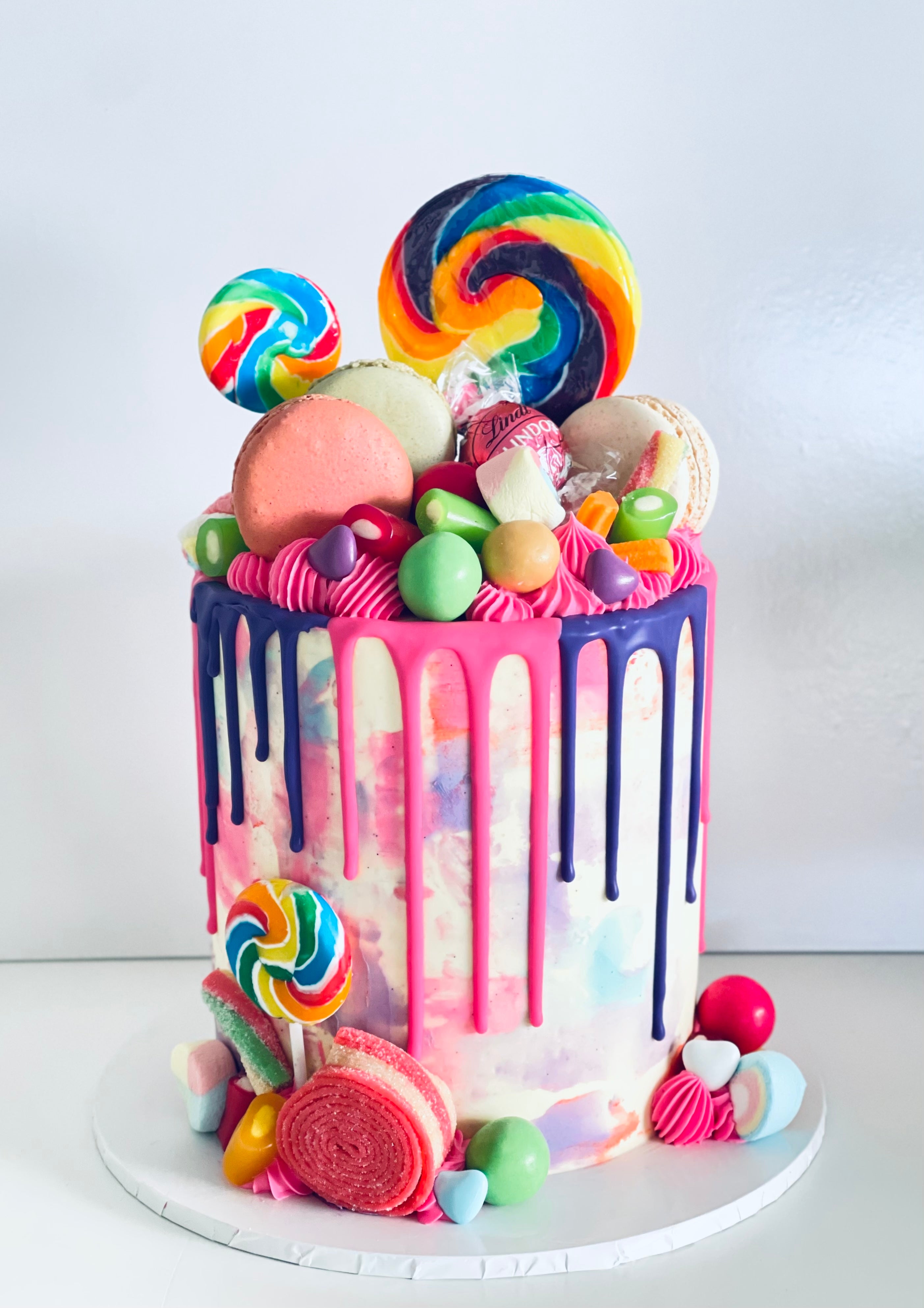 Kids birthday cake with chocoalte drip, lollies, chocolates,marshamllows and more