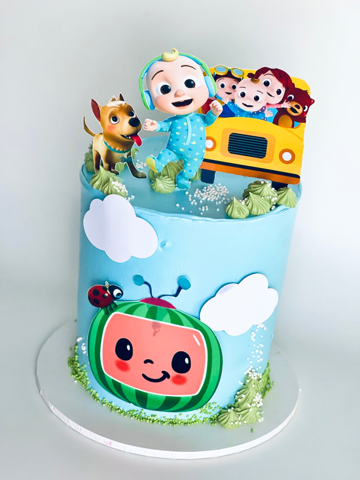 Colorful Cocomelon-themed birthday cake with vibrant decorations and Brisbane delivery option