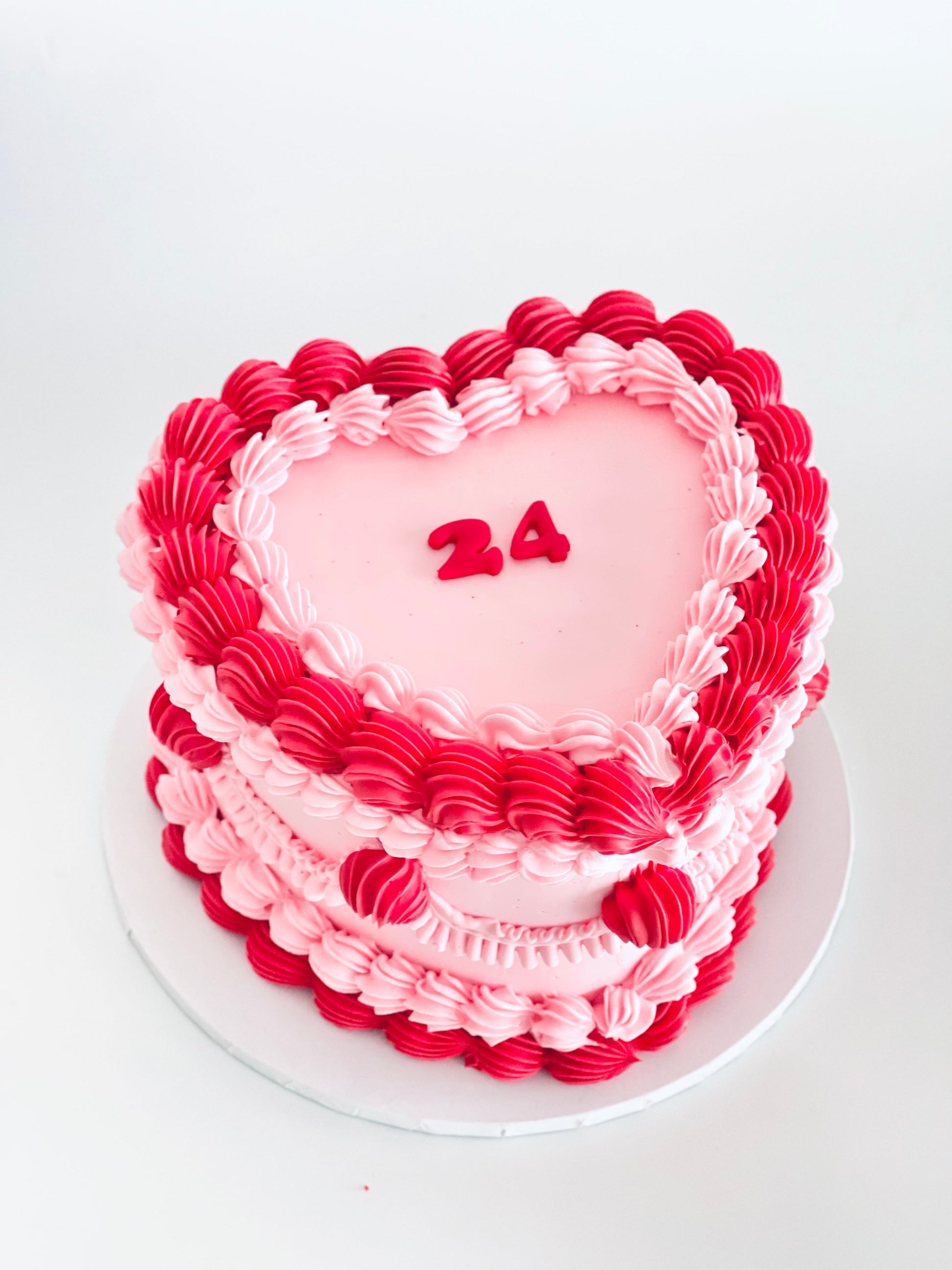 pink vintage heart shape cake with birthday number
