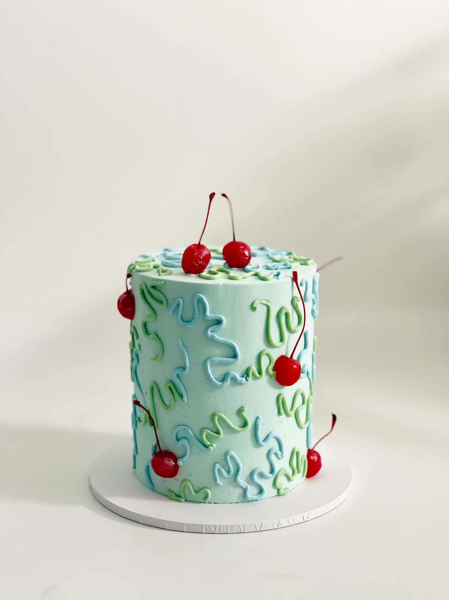 abstract cake with wiggles and cherries
