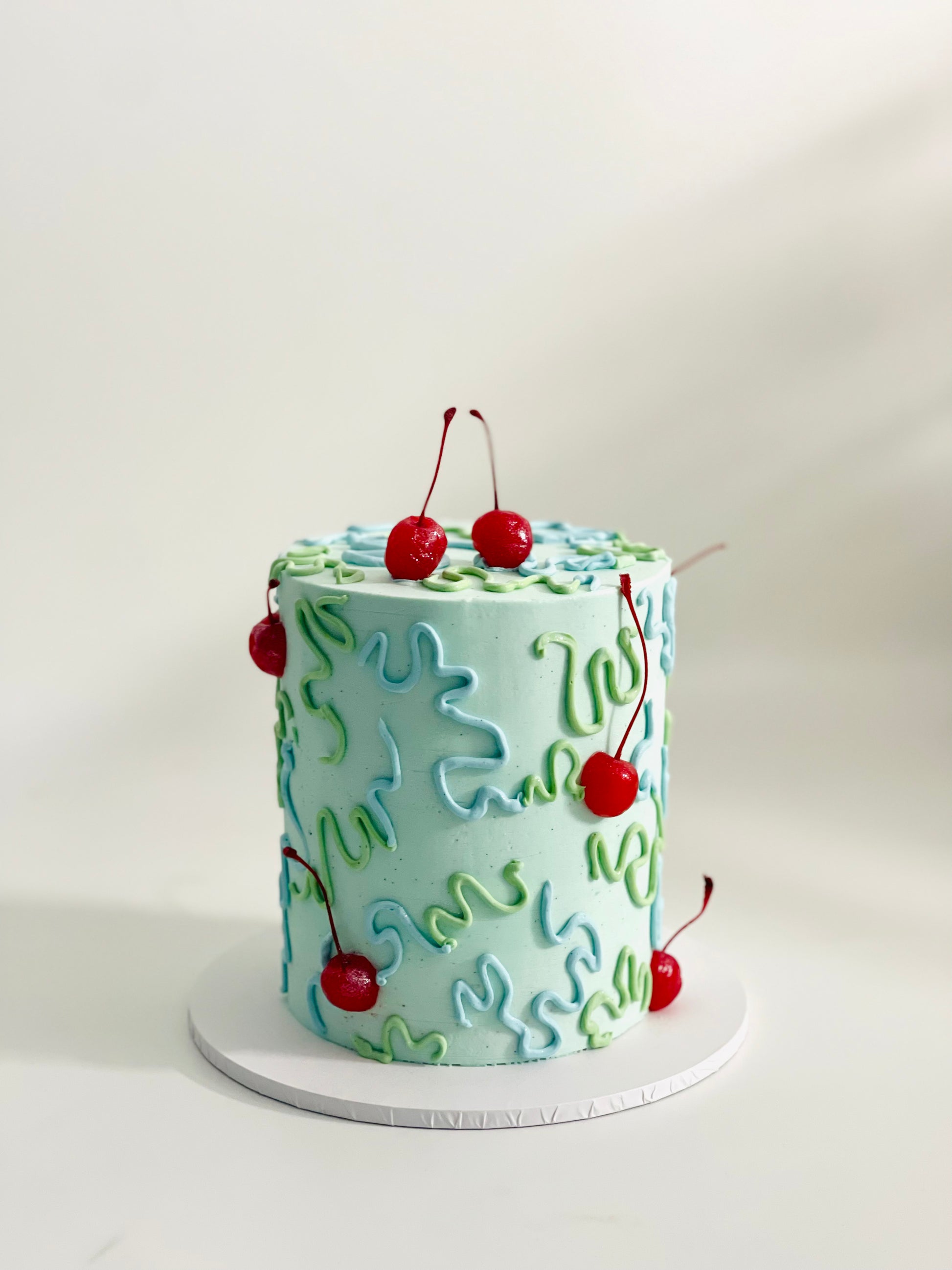 abstract cake with wiggles and cherries